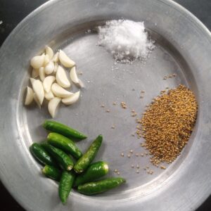 Mustard seeds and green chillies